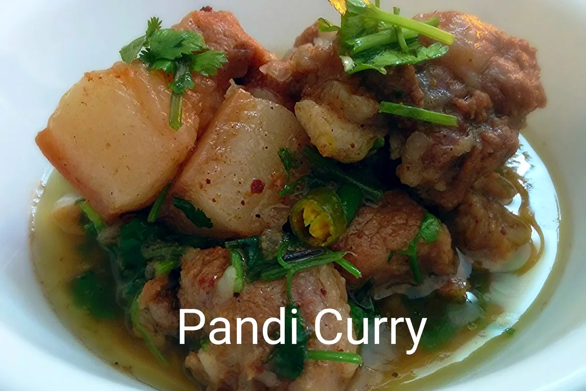 Pandi curry representing the cuisine of Kodagu district
