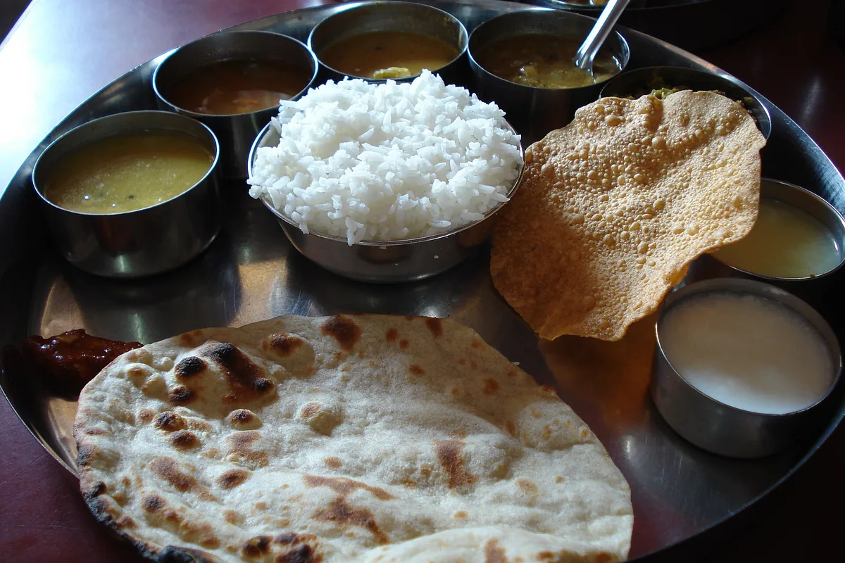 Traditional Udupi vegetarian meal served with rice and accompaniments